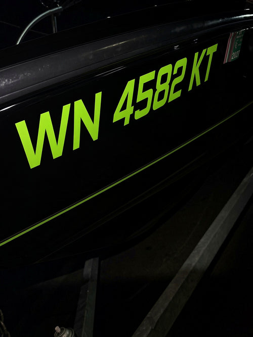 Custom boat lettering installed on a marine hull