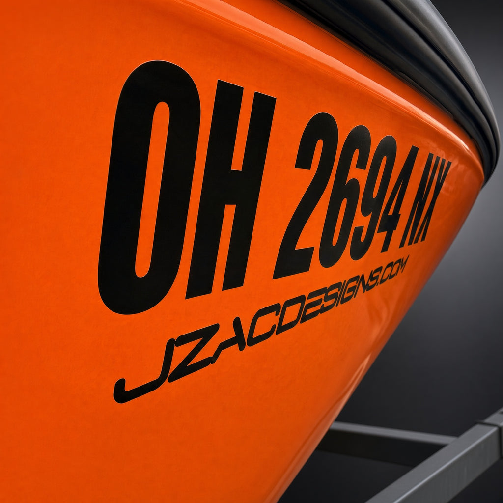 Boat registration lettering installed on a dark boat hull