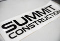 Summit Construction lettering – black vinyl on flat surface