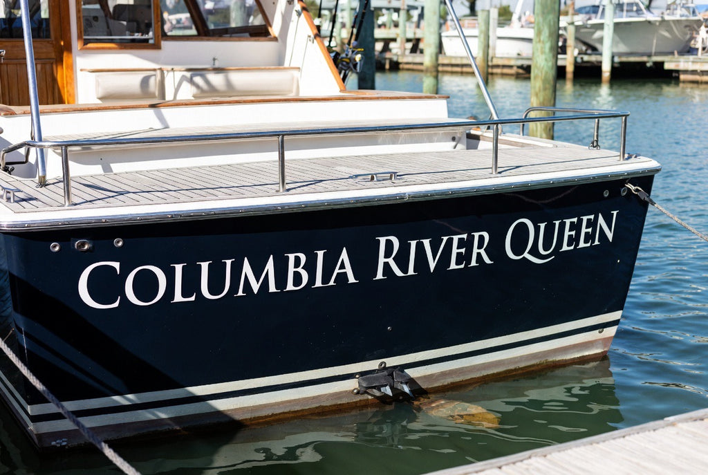 Custom boat name lettering applied to a boat hull