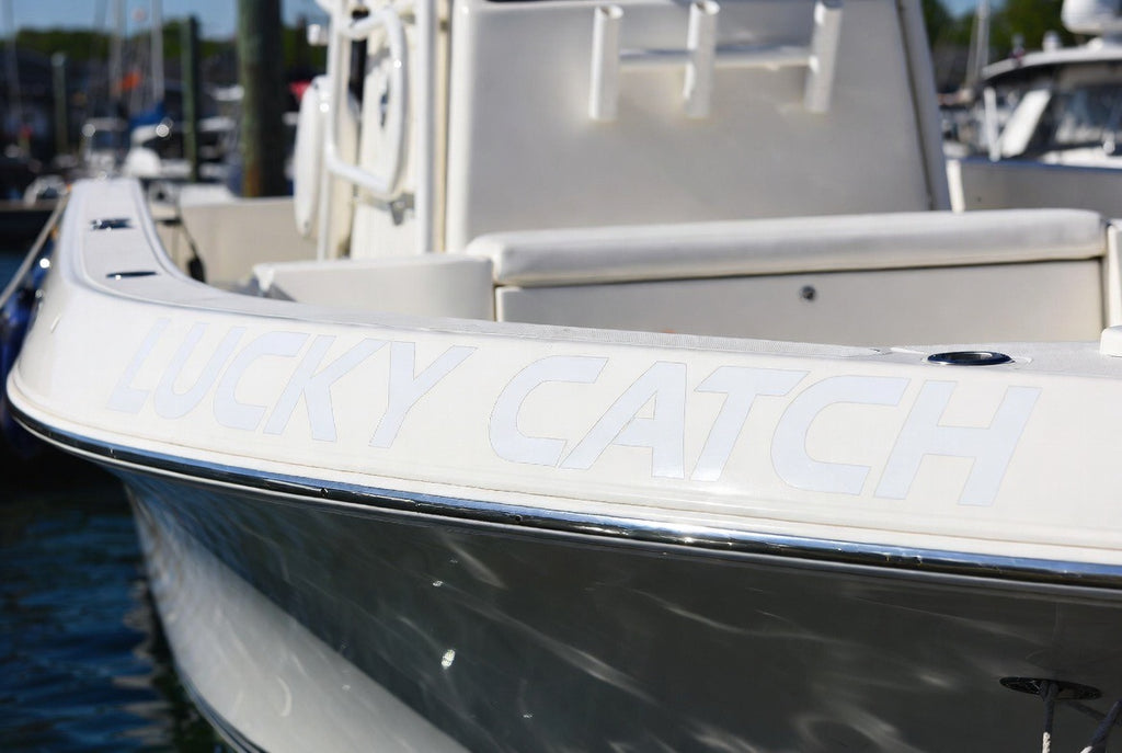 Lucky Catch boat name lettering at marina