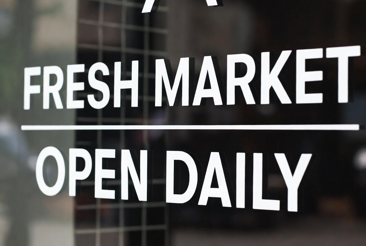 Storefront glass with installed business window lettering