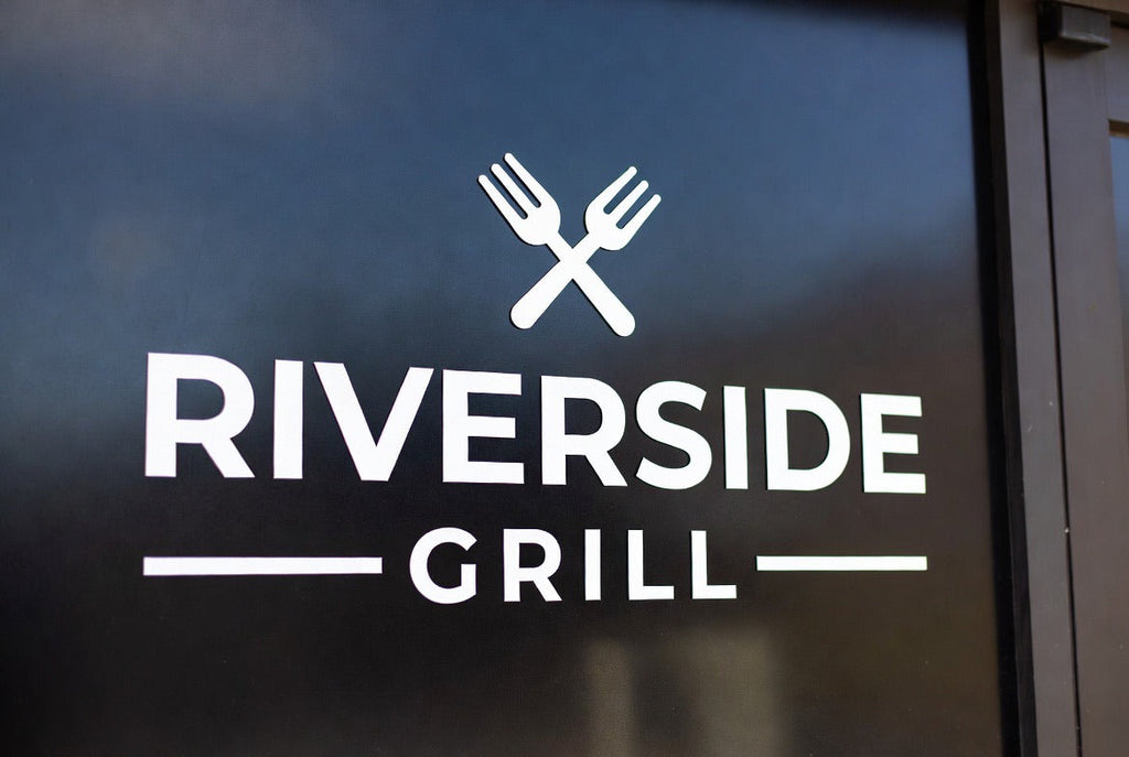 Storefront window logo in cut vinyl on retail glass