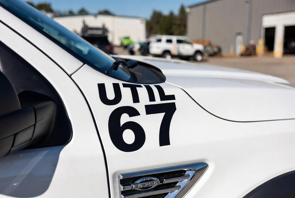 UTIL 67 black lettering on white work truck hood