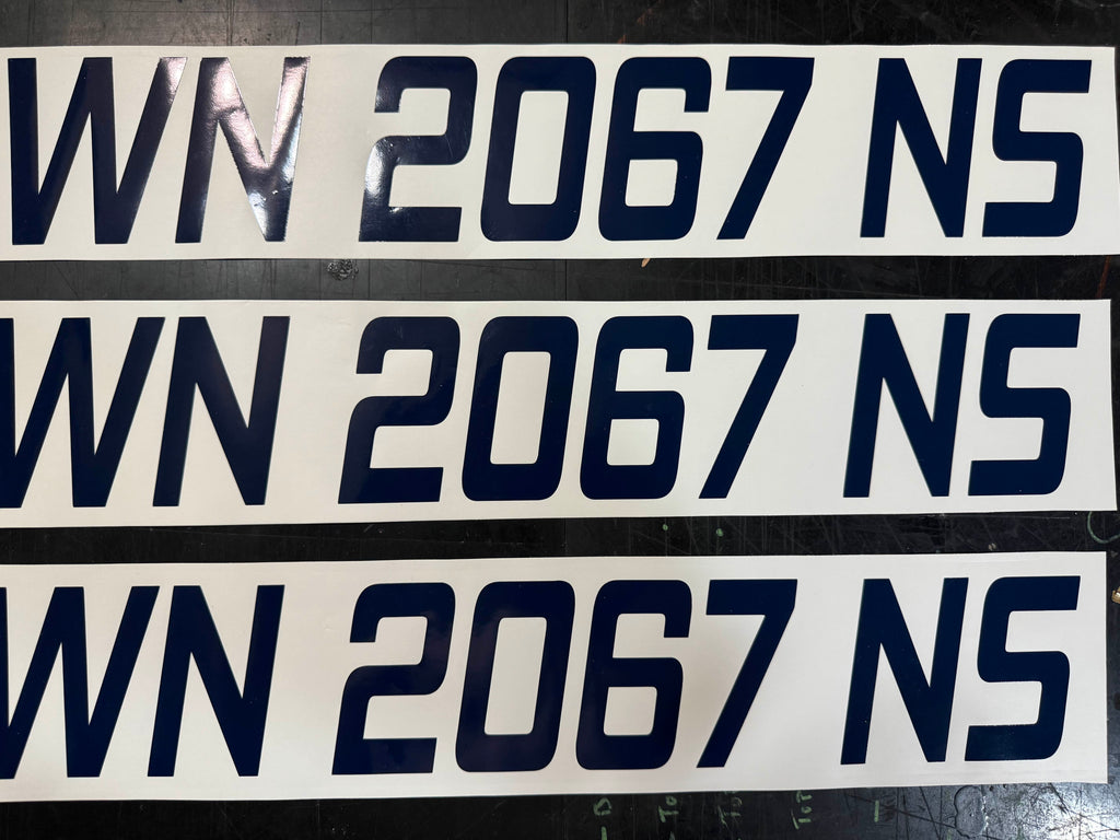 Three sets of navy boat registration numbers cut and ready to ship
