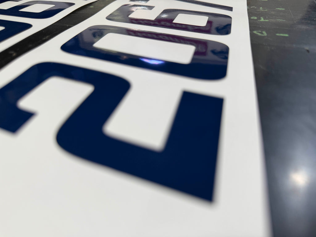 Marine vinyl lettering prepared for boat installation