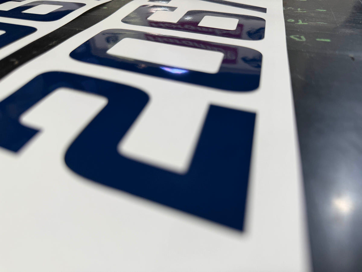 Marine vinyl lettering prepared for boat installation