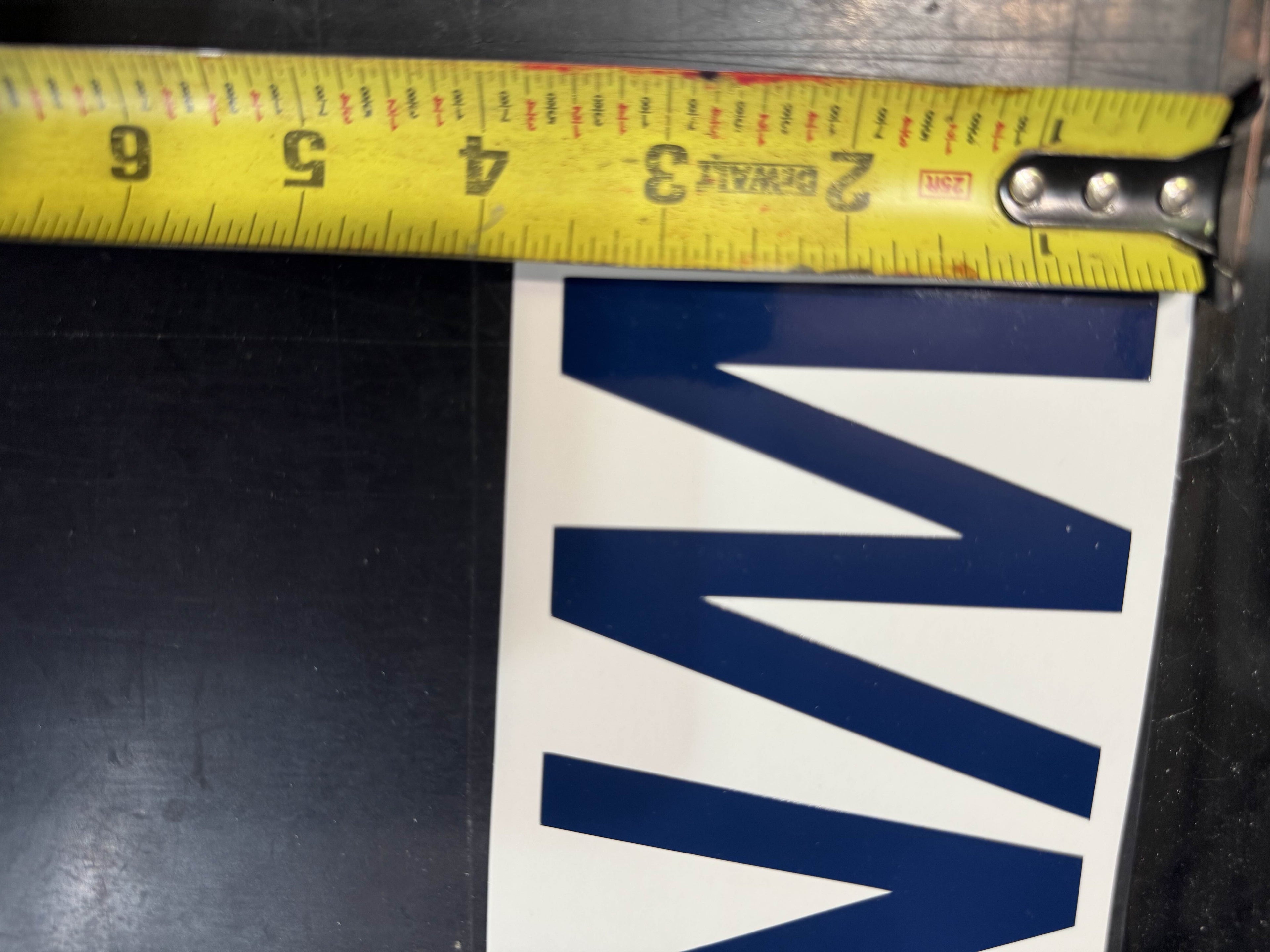 Boat registration numbers measured against a tape - 3 inch cap height, USCG legal