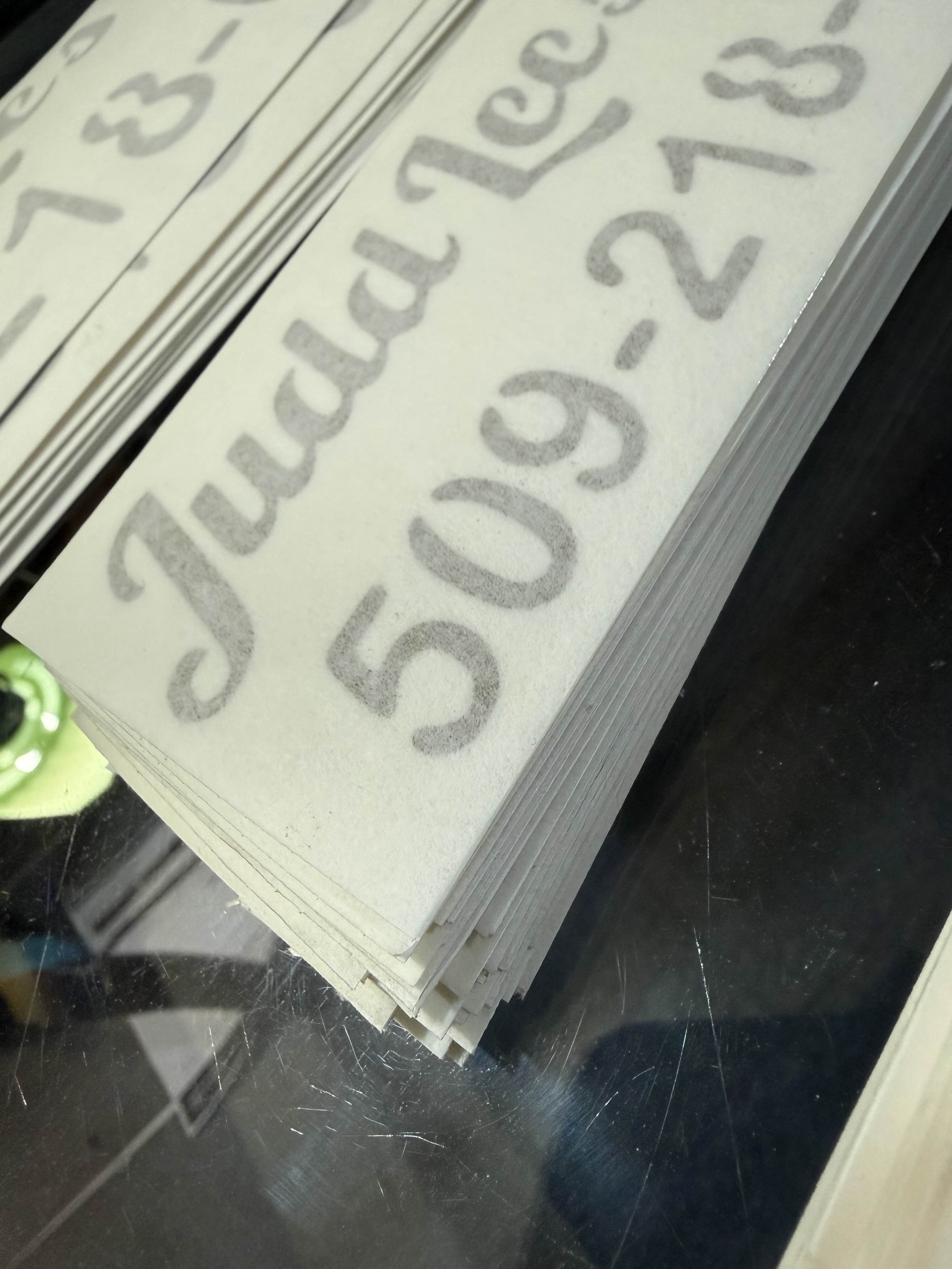 Production run of custom branded decals, cut and stacked ready for delivery