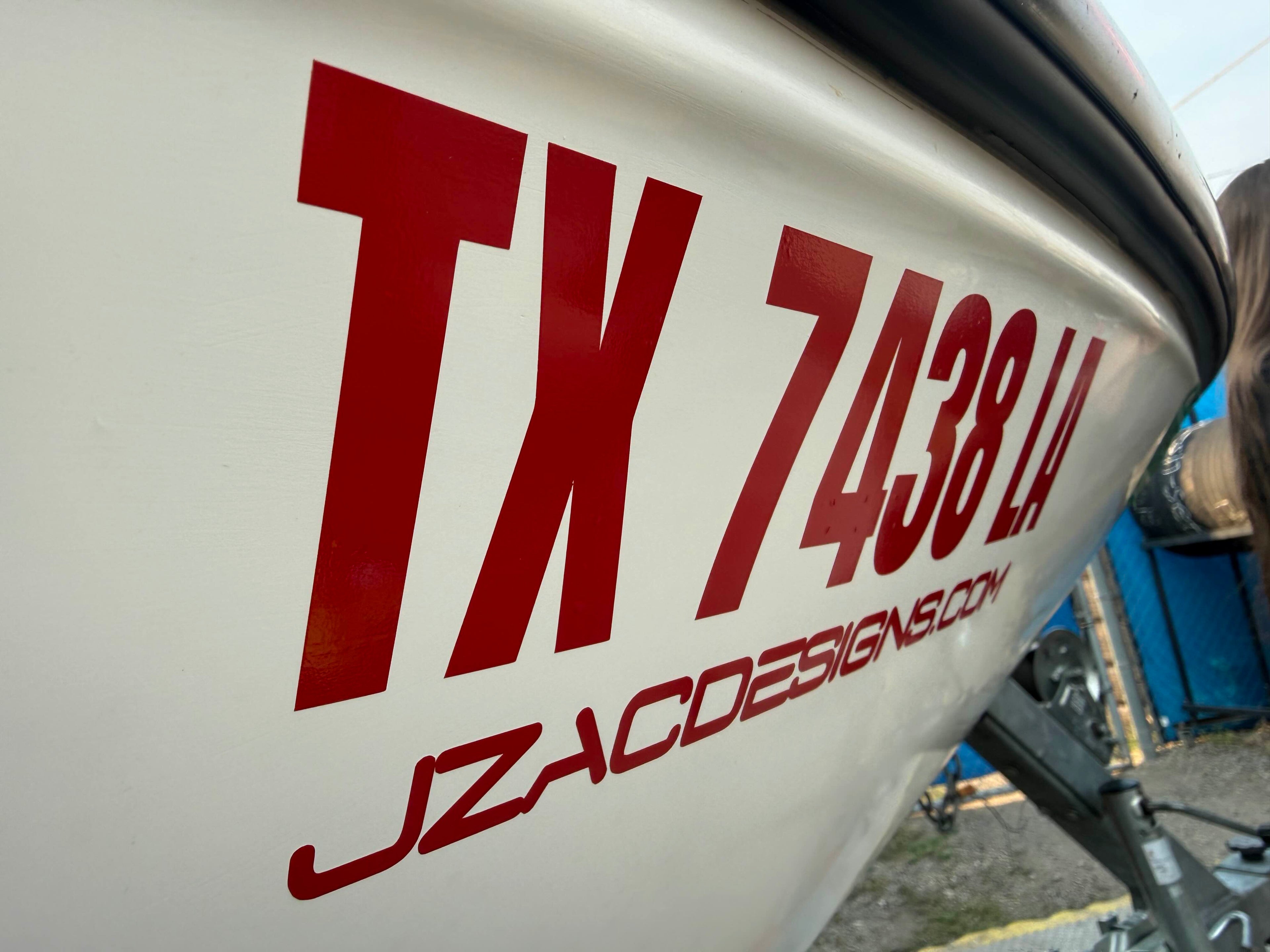 Close-up of marine vinyl lettering on a boat hull - crisp cut detail