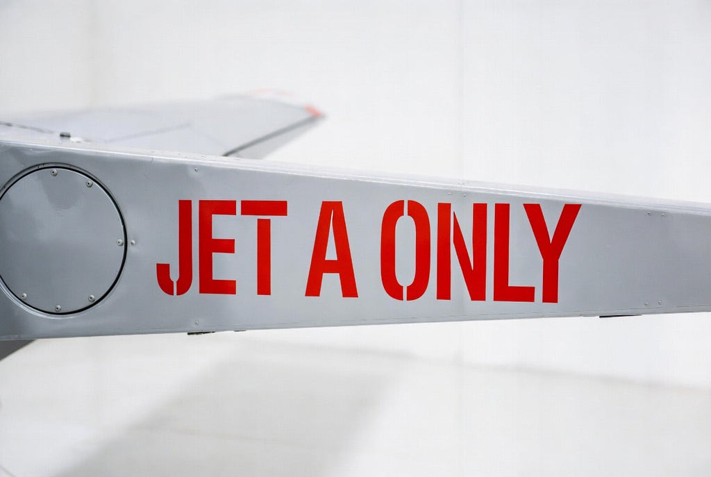 JET A ONLY fuel placard applied to a grey aircraft wing