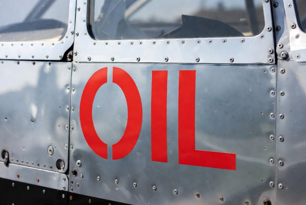 OIL placard applied to polished aluminium aircraft skin