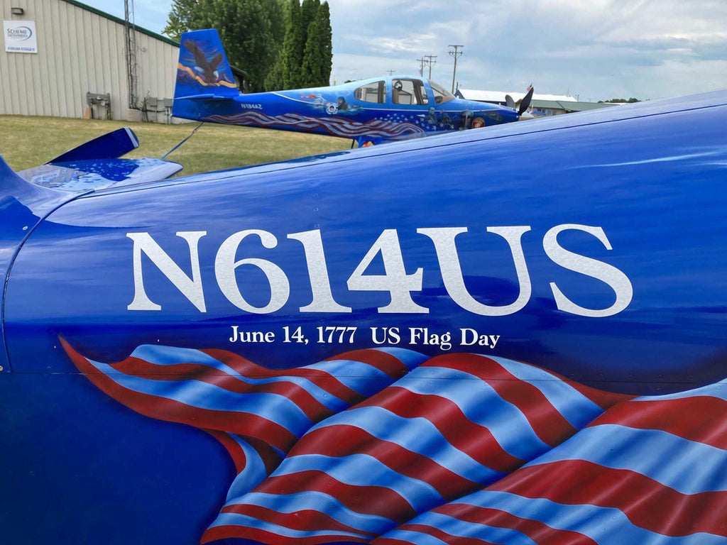 Custom aircraft graphics - registration lettering in blue with flag artwork, cut vinyl