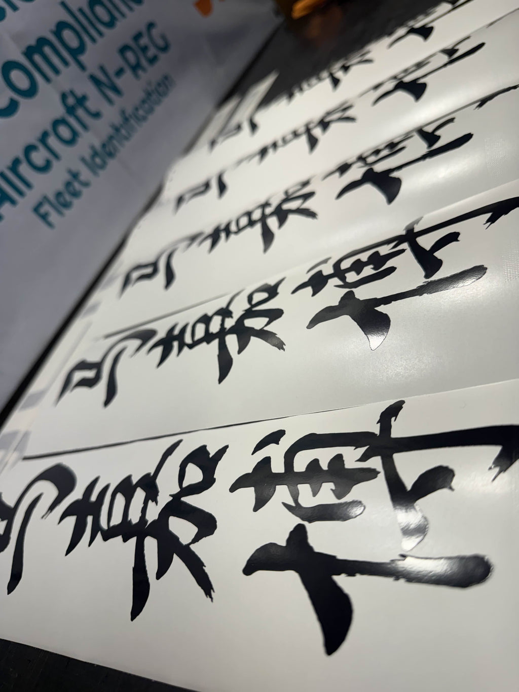 Custom vinyl logo and lettering production example