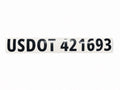 White USDOT number lettering on a black commercial truck door