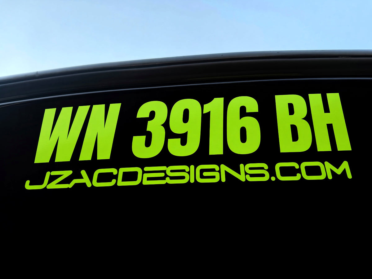 Bright green WN 3916 BH registration lettering and JZACDESIGNS.COM on a black surface