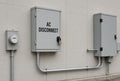 Illustration of AC DISCONNECT cut-vinyl lettering applied to a solar AC disconnect enclosure