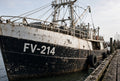 Illustration of FV-214 cut-vinyl official vessel numbers on a commercial fishing vessel bow