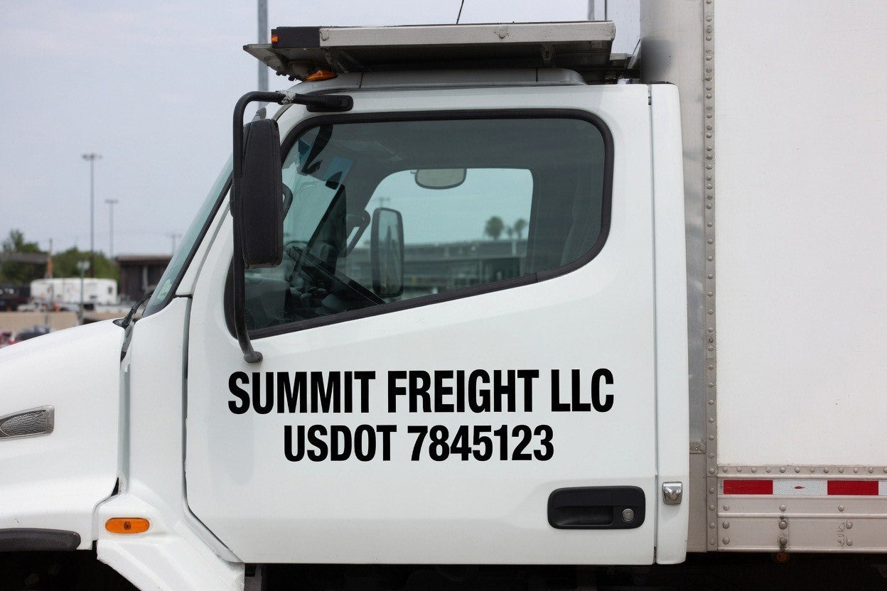 USDOT number decal installed on a truck door in white cut vinyl