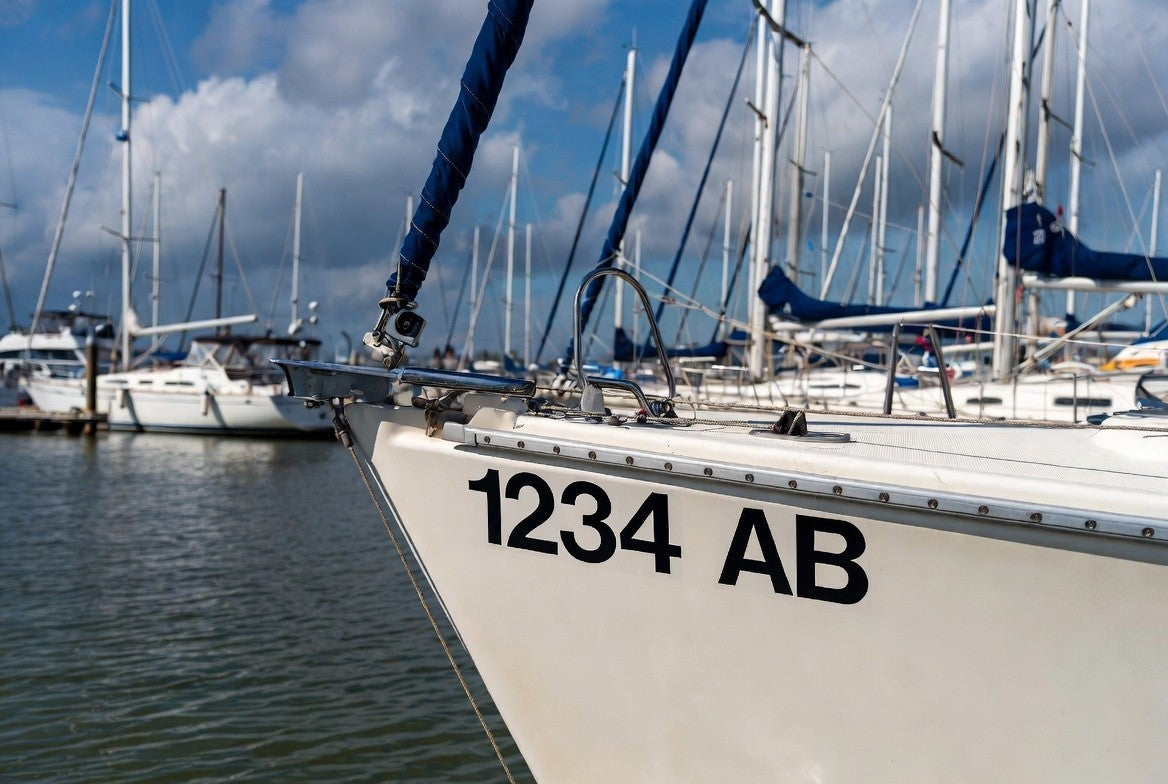 Boat registration numbers installed on bow - 1234 AB