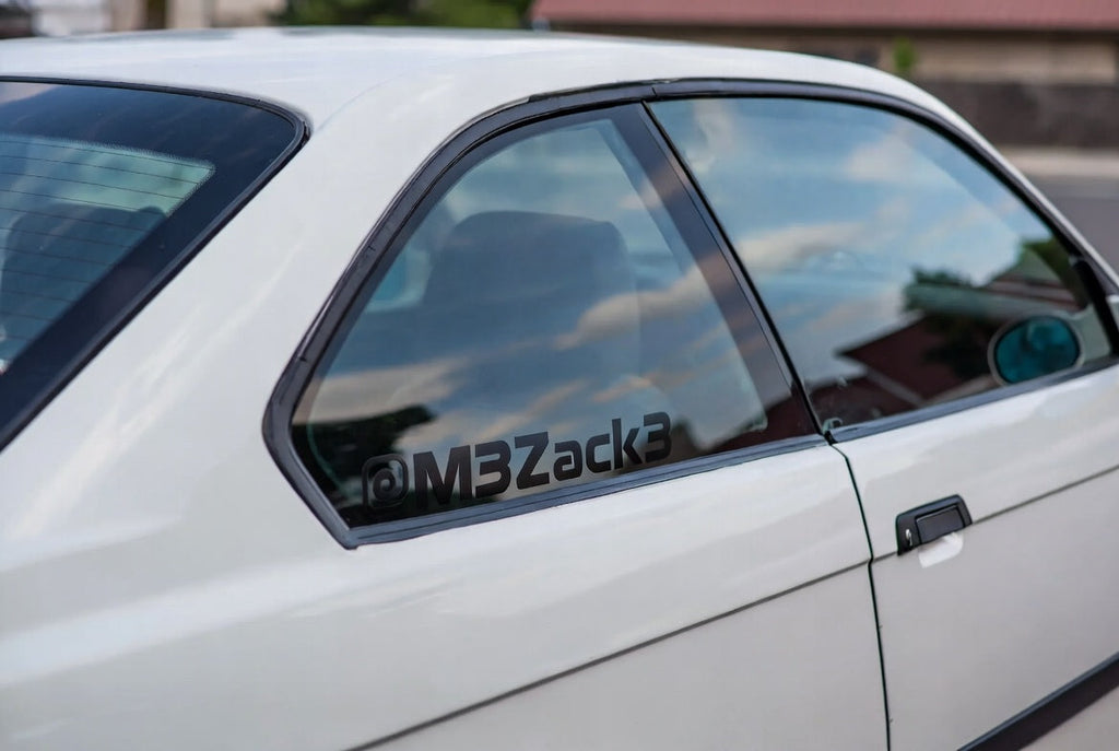 Cut vinyl lettering applied to a vehicle quarter window - rear glass lettering by JZAC Designs